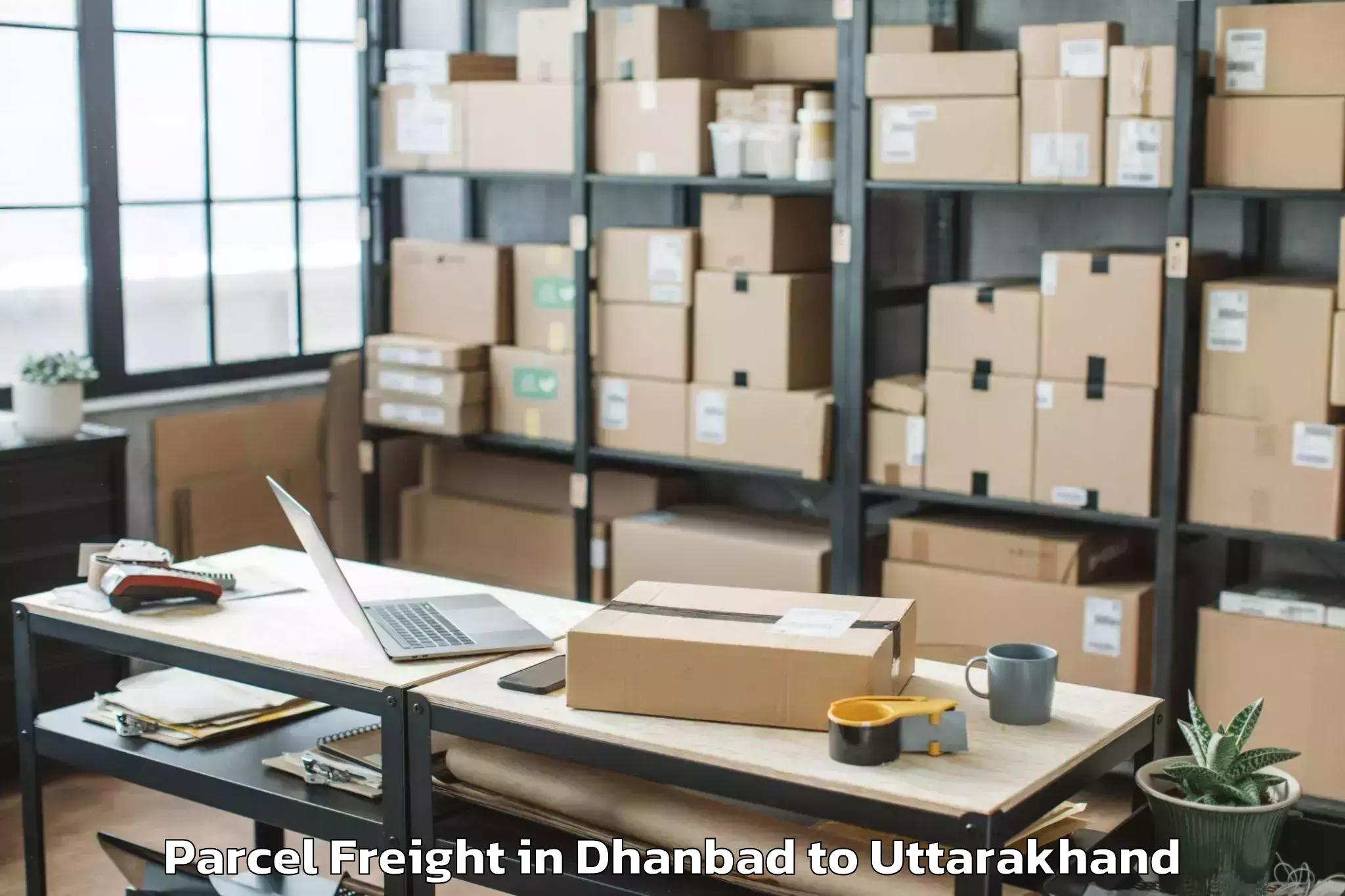 Easy Dhanbad to Herbertpur Parcel Freight Booking